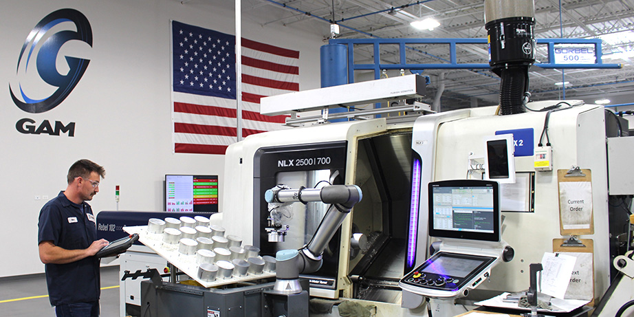 Mike, one of our CNC setup operator works side-by-side with a cobot, handling the high-level machine setup and teaching the cobot to load and unload precision parts.
